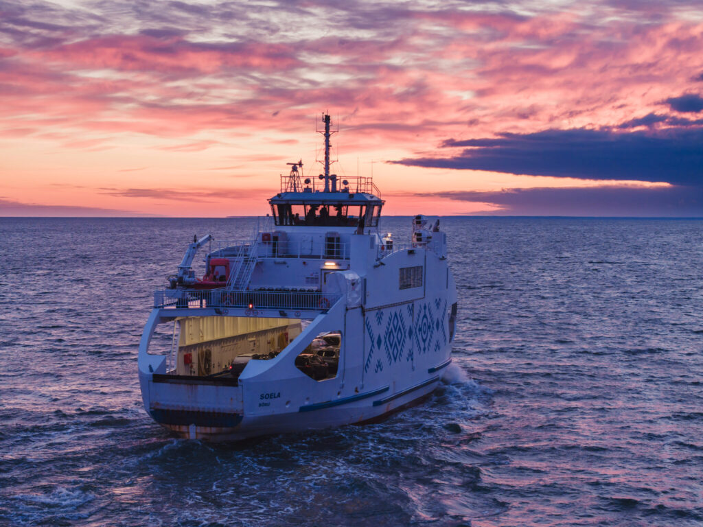 Ferry from REISFER project, sailing on the sea to the sunset