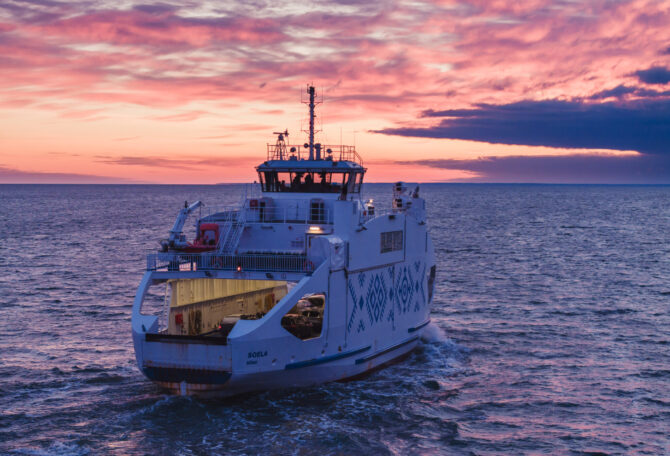 Ferry from REISFER project, sailing on the sea to the sunset